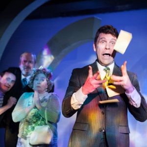 surprised man tosses papers in the air